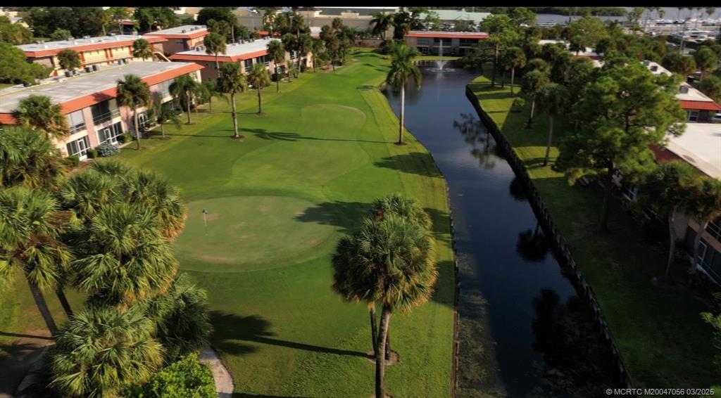 1985 Southwest Palm City Road, Unit 44I Stuart, FL 34994 - Photo 26 of 31 an aerial view of residential houses with outdoor space