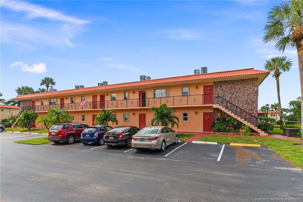 1985 Southwest Palm City Road, Unit 44I Stuart, FL 34994 - Photo 3 of 31 a front view of a building with parking