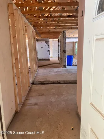 a view of a hallway with entryway