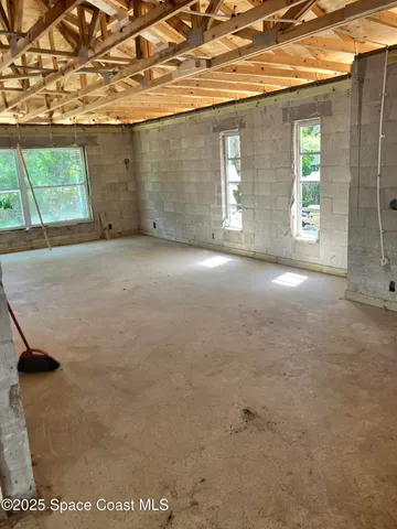 an empty room with windows