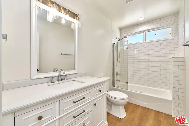 a bathroom with a bathtub and shower