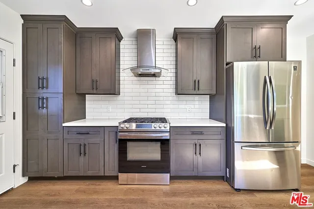 a kitchen with a white cabinets sink and window