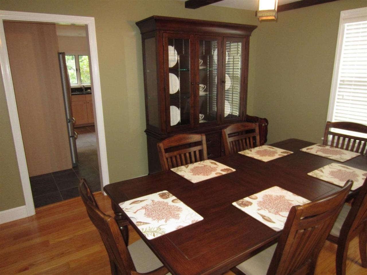 83 Potonumecot Road Chatham, MA 02633 - Photo 12 of 34 a view of a dining room with furniture window and wooden floor