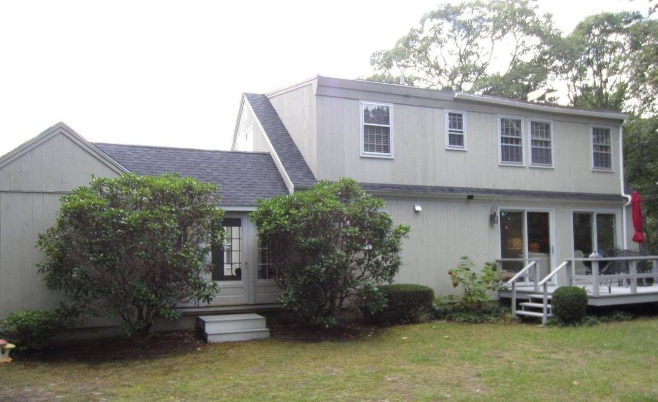83 Potonumecot Road Chatham, MA 02633 - Photo 30 of 34 a front view of a house with garden