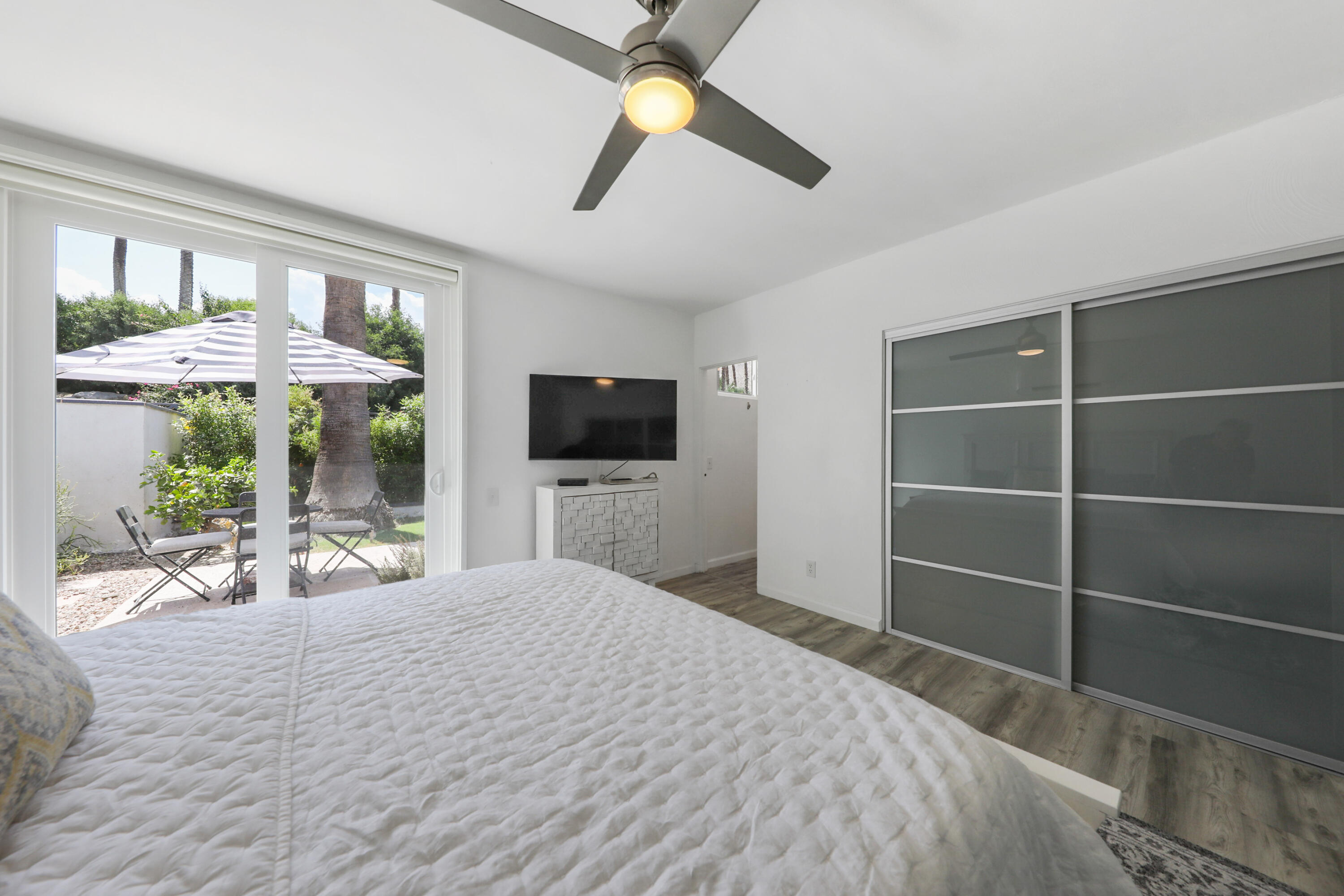 71333 Halgar Road Rancho Mirage, CA 92270 - Photo 15 of 33 a bedroom with a bed and a flat screen tv