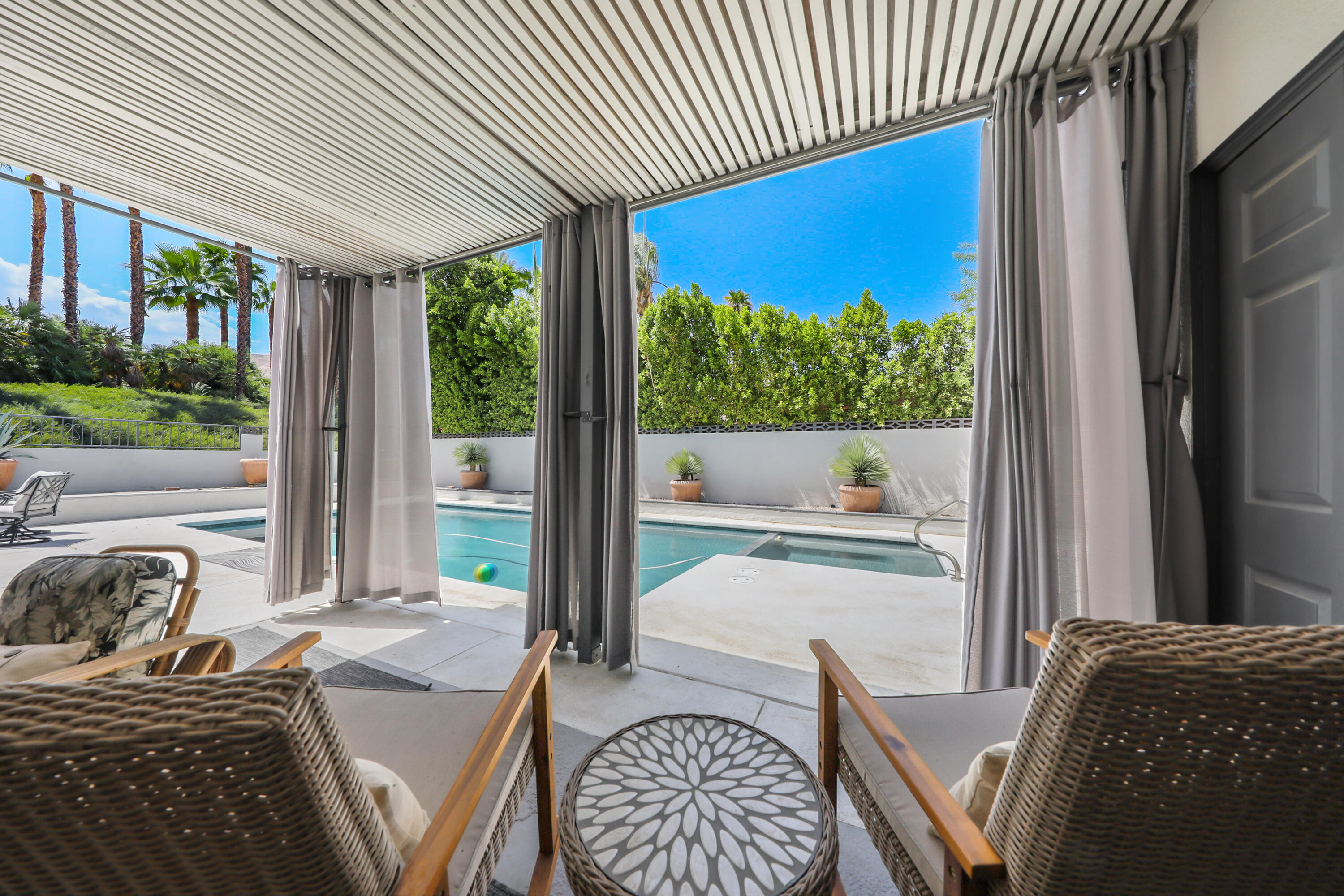 71333 Halgar Road Rancho Mirage, CA 92270 - Photo 22 of 33 a bedroom with furniture and a large window