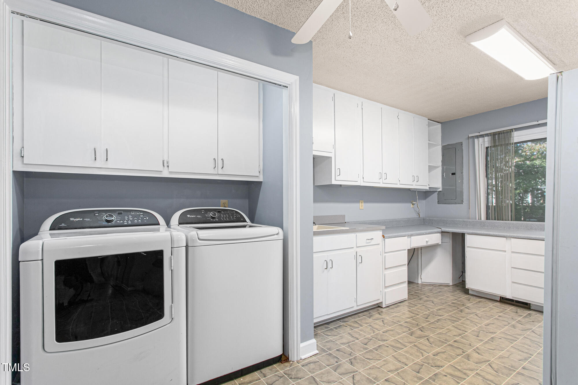 809 Brookview Drive Elon, NC 27244 - Photo 19 of 53 a kitchen with a stove sink and cabinets