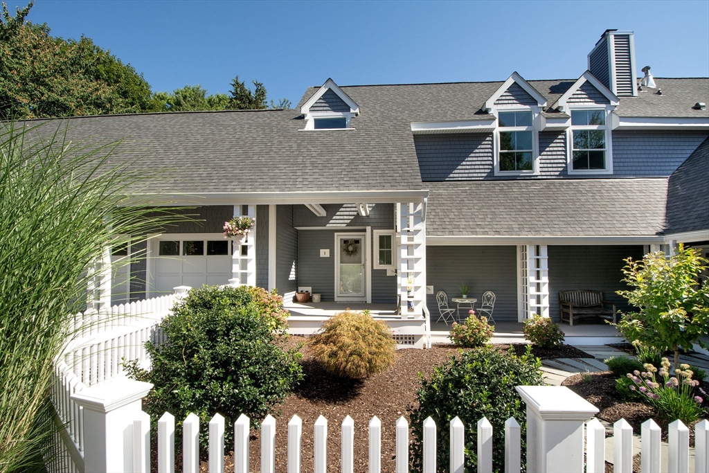 1 Gatehouse Lane, Unit 1 Hull, MA 02045 - Photo 1 of 42 a front view of a house with a porch