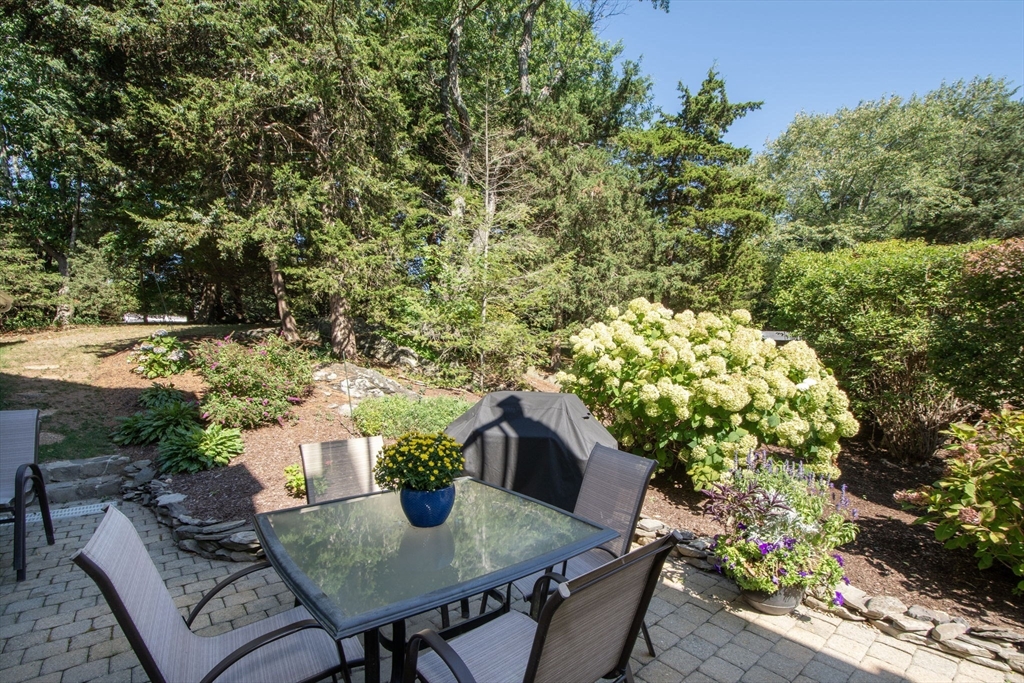 1 Gatehouse Lane, Unit 1 Hull, MA 02045 - Photo 12 of 42 a backyard of a house with lots of green space