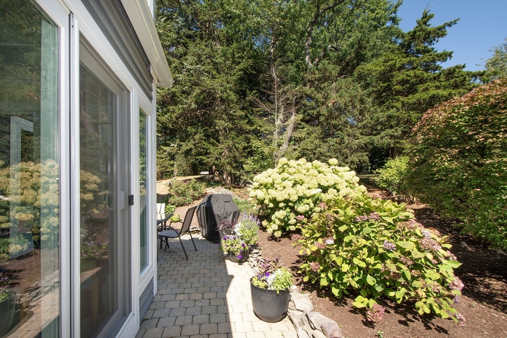 1 Gatehouse Lane, Unit 1 Hull, MA 02045 - Photo 14 of 42 a balcony with a lots of plants and flowers