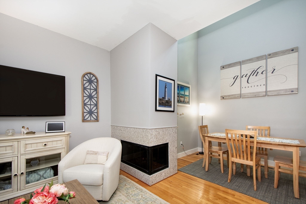 1 Gatehouse Lane, Unit 1 Hull, MA 02045 - Photo 18 of 42 a living room with furniture and a flat screen tv