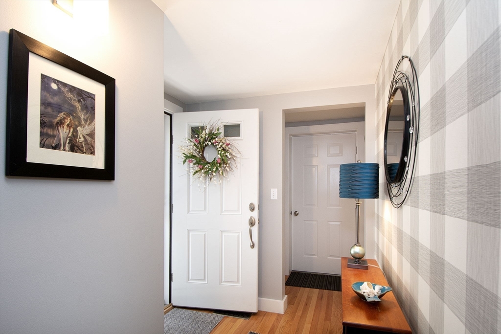 1 Gatehouse Lane, Unit 1 Hull, MA 02045 - Photo 22 of 42 a view of an entryway with wooden floor