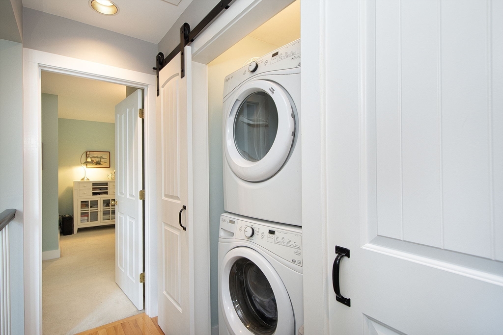 1 Gatehouse Lane, Unit 1 Hull, MA 02045 - Photo 29 of 42 a utility room with dryer and washer