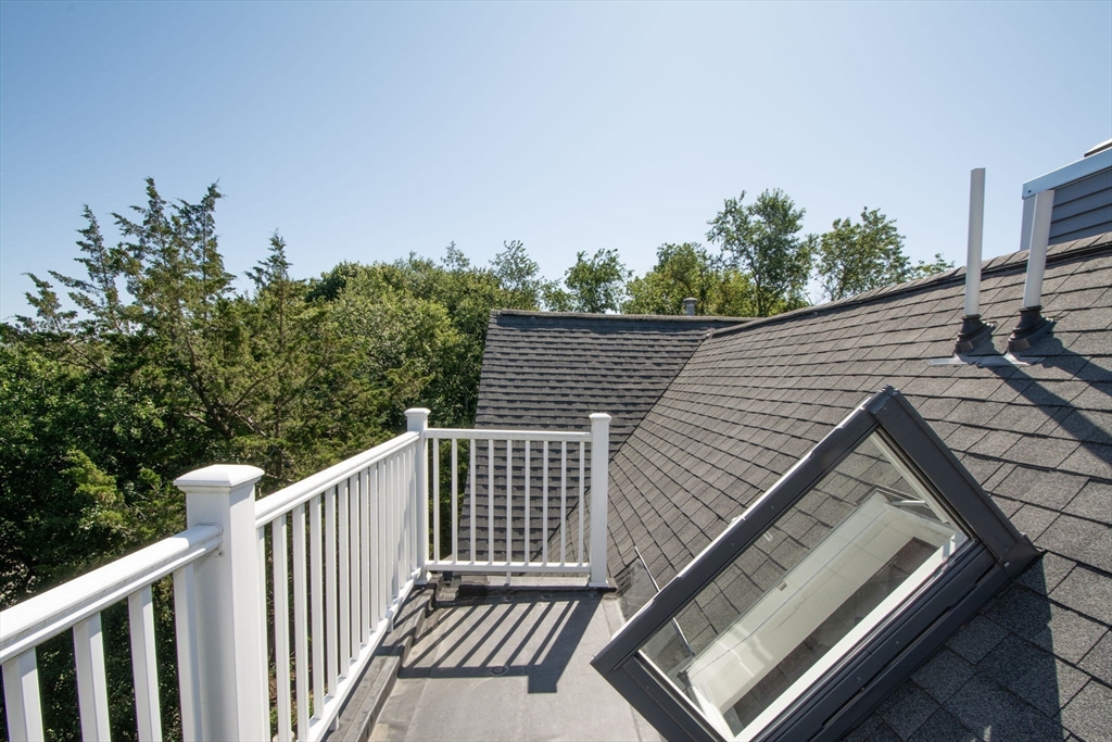 1 Gatehouse Lane, Unit 1 Hull, MA 02045 - Photo 32 of 42 a view of balcony with wooden floor and fence