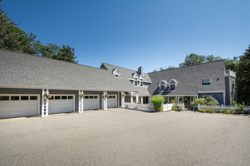 1 Gatehouse Lane, Unit 1 Hull, MA 02045 - Photo 36 of 42 a front view of a house with a yard
