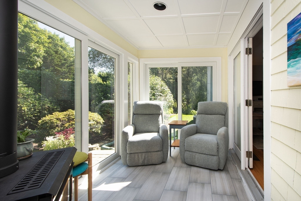 1 Gatehouse Lane, Unit 1 Hull, MA 02045 - Photo 9 of 42 a living room with furniture and a floor to ceiling window