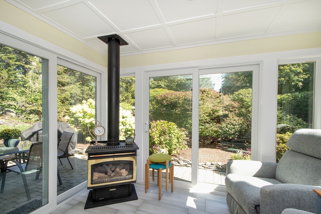 1 Gatehouse Lane, Unit 1 Hull, MA 02045 - Photo 10 of 42 a living room with furniture and a fireplace
