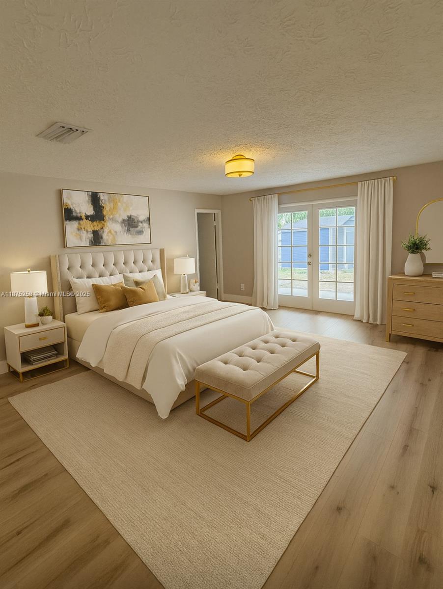 Floresta Pointe Port St. Lucie, FL 34983 - Photo 1 of 5 a bedroom with a large bed and a large window