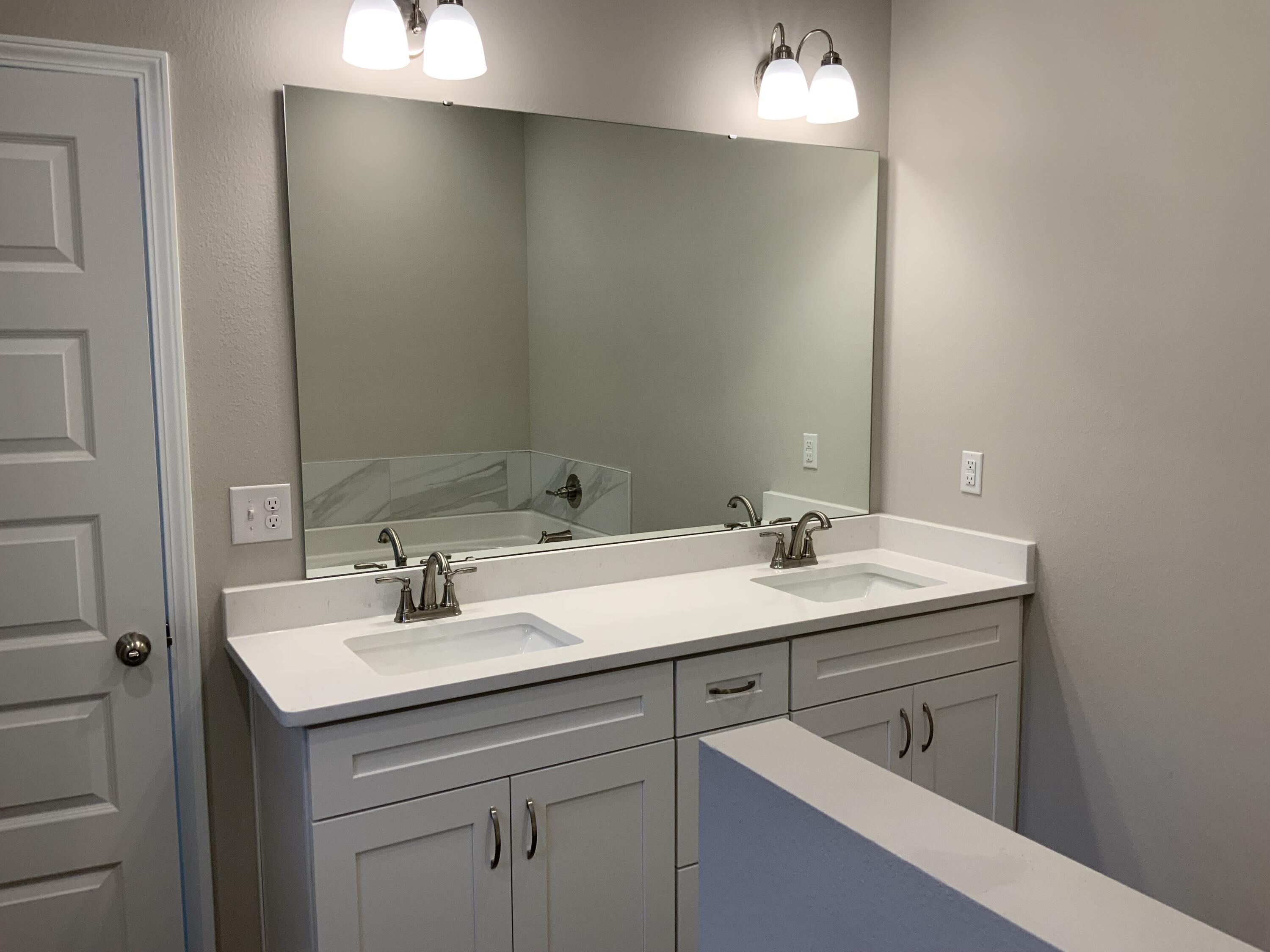 5179 Rabbit Run Crestview, FL 32539 - Photo 11 of 18 a bathroom with a sink double vanity and a mirror
