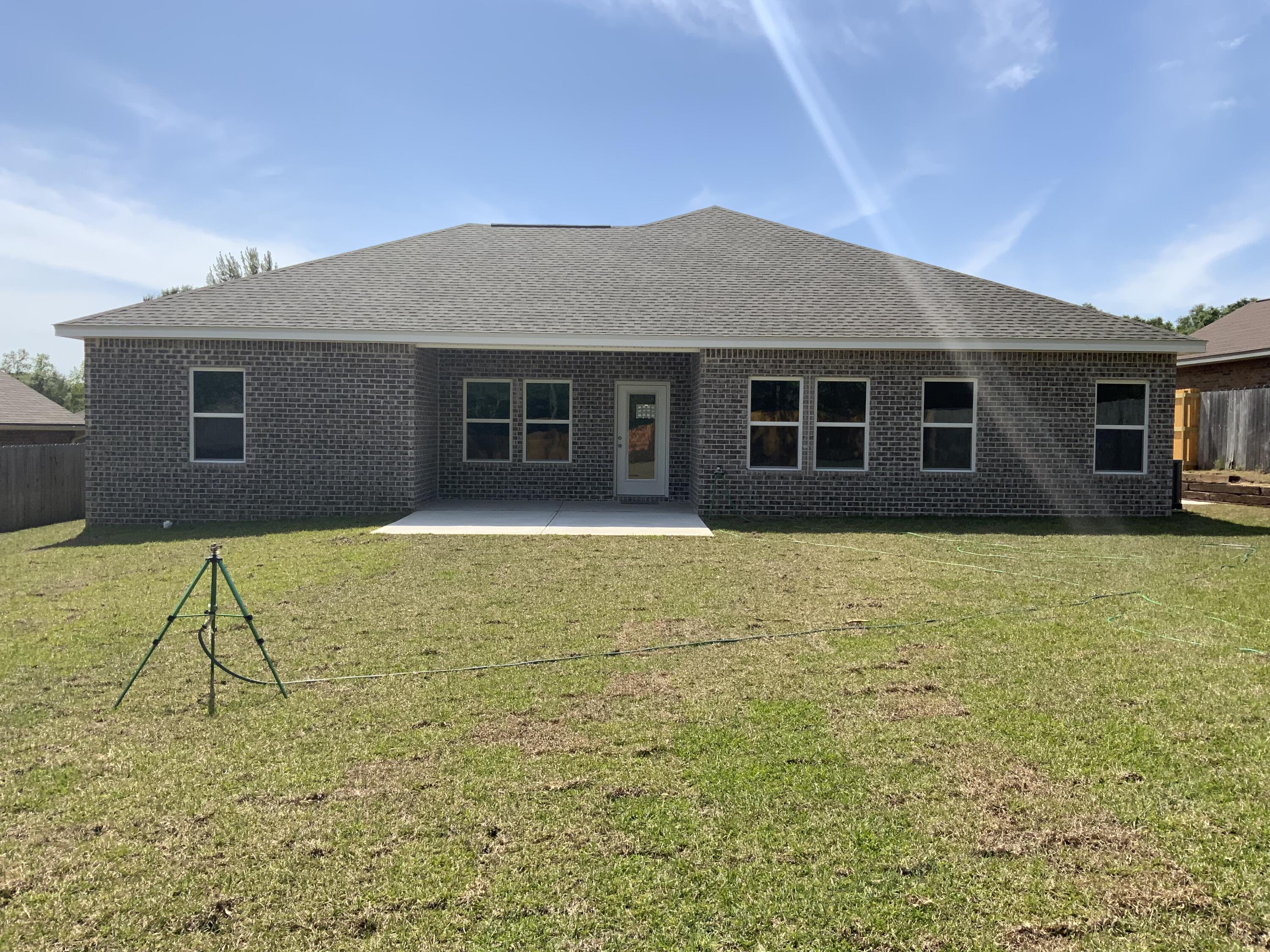 5179 Rabbit Run Crestview, FL 32539 - Photo 18 of 18 a house that has a tree in it