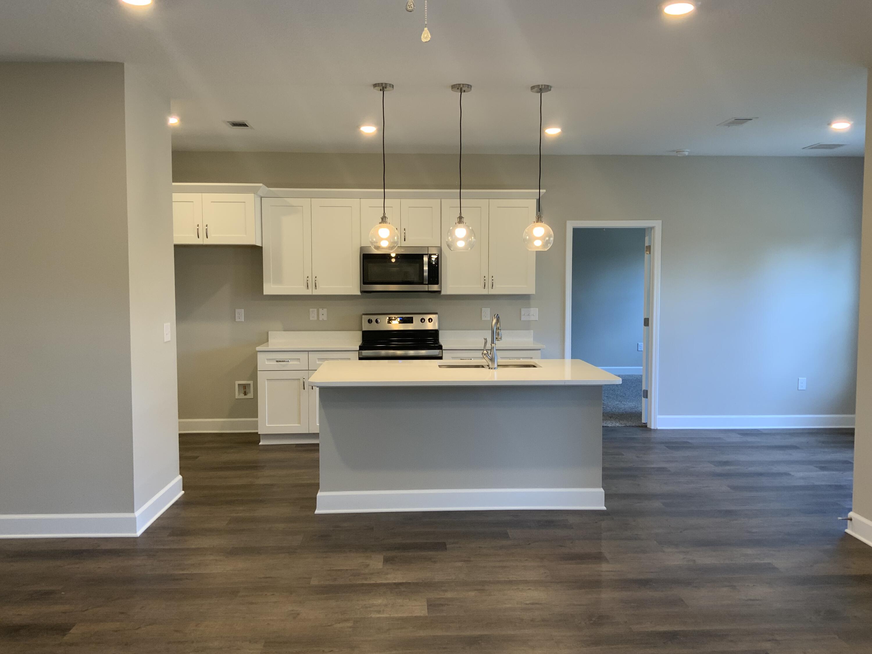 5179 Rabbit Run Crestview, FL 32539 - Photo 5 of 18 a view of kitchen with stainless steel appliances granite countertop cabinets and wooden floor