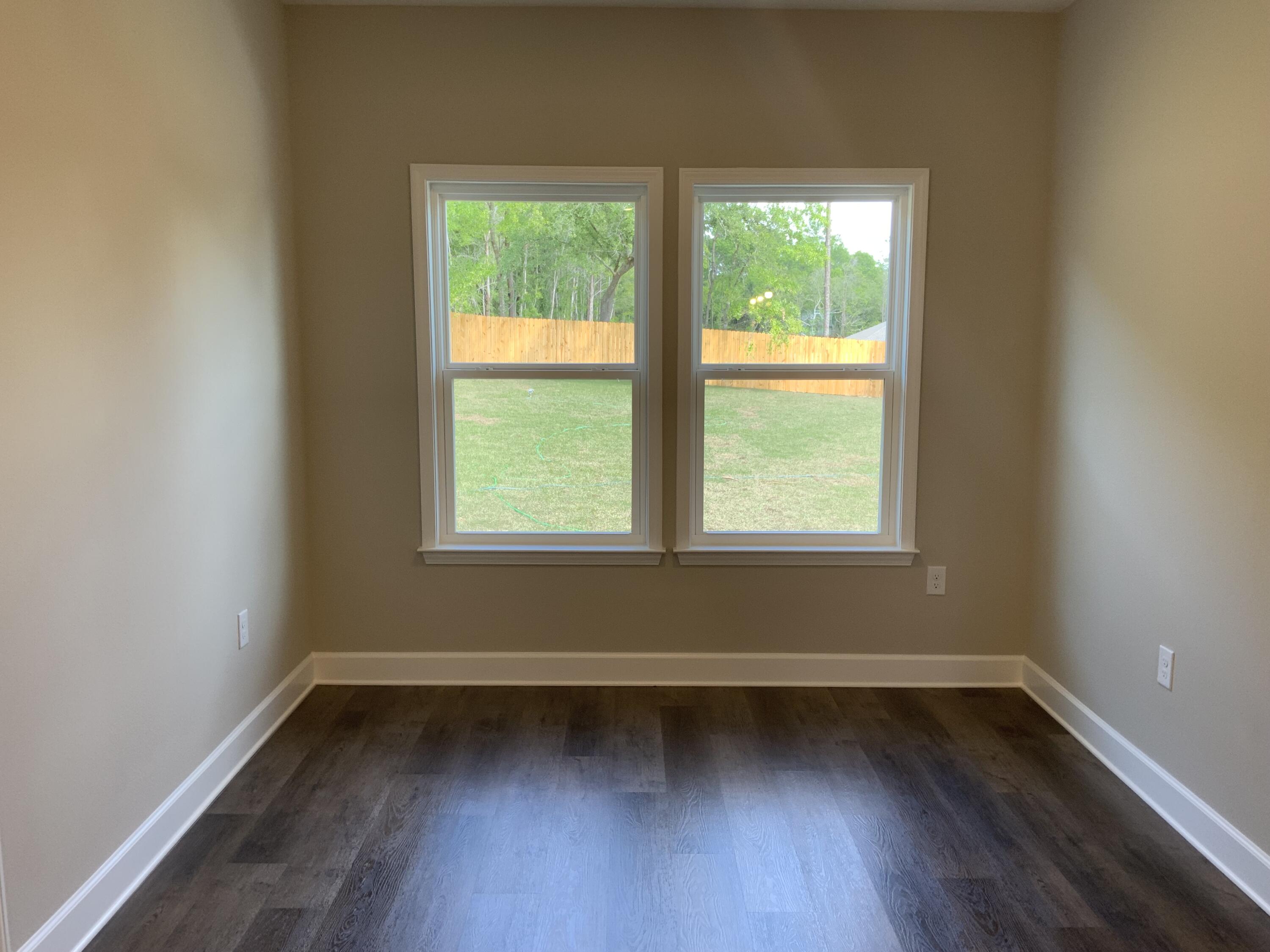 5179 Rabbit Run Crestview, FL 32539 - Photo 7 of 18 a view of a room with wooden floor and a window