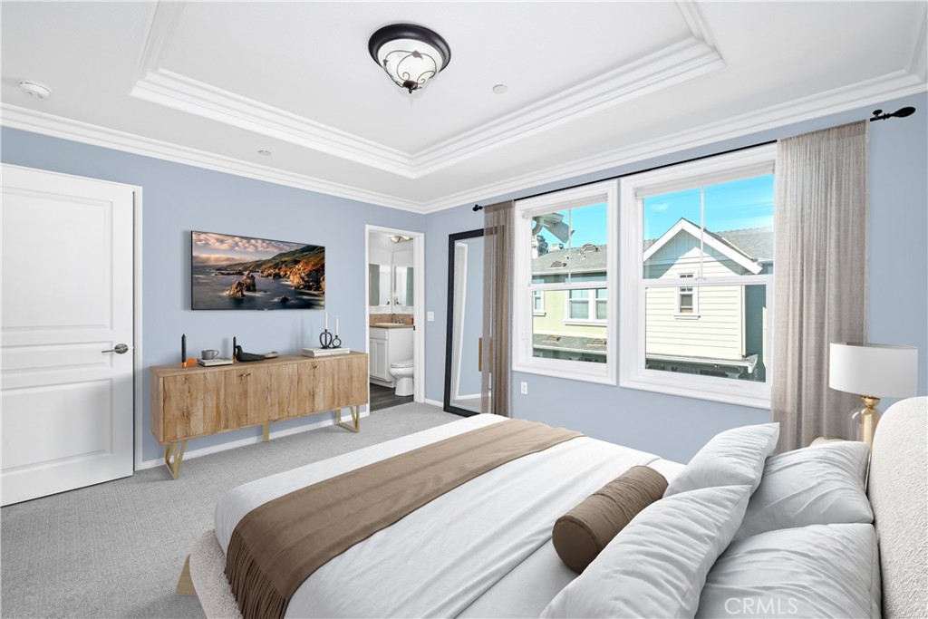 22 Valmont Way Ladera Ranch, CA 92694 - Photo 18 of 47 a bedroom with a large bed couch and a window