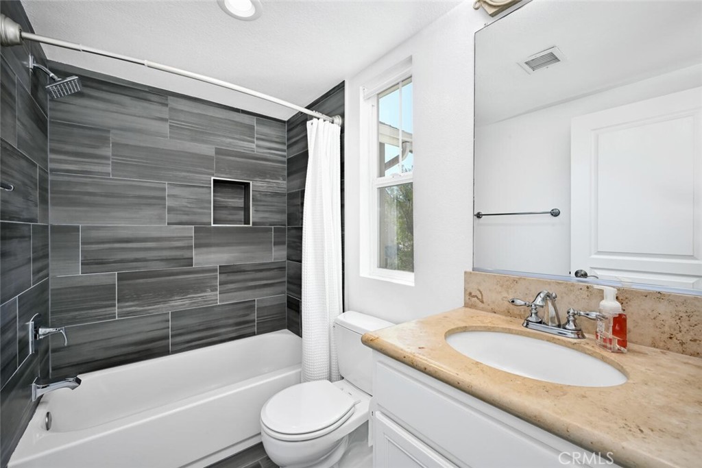22 Valmont Way Ladera Ranch, CA 92694 - Photo 19 of 47 a bathroom with a granite countertop sink toilet and shower