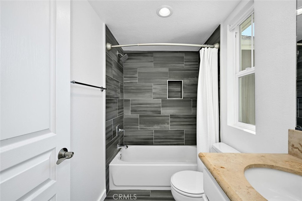 22 Valmont Way Ladera Ranch, CA 92694 - Photo 20 of 47 a bathroom with a granite countertop bathtub shower sink vanity and toilet