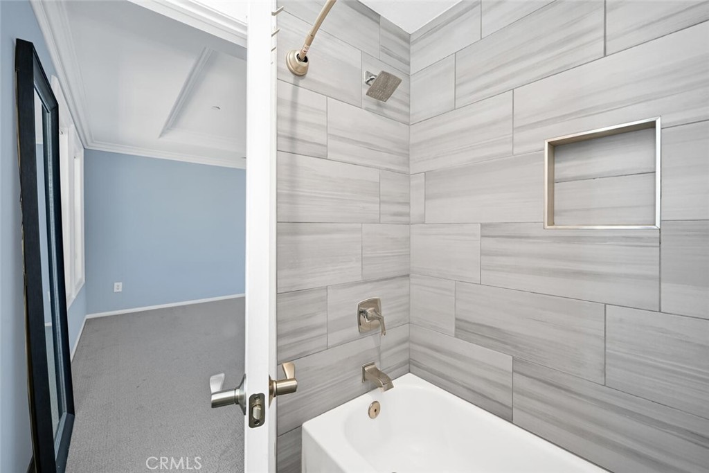 22 Valmont Way Ladera Ranch, CA 92694 - Photo 22 of 47 a bathroom with a bathtub and shower