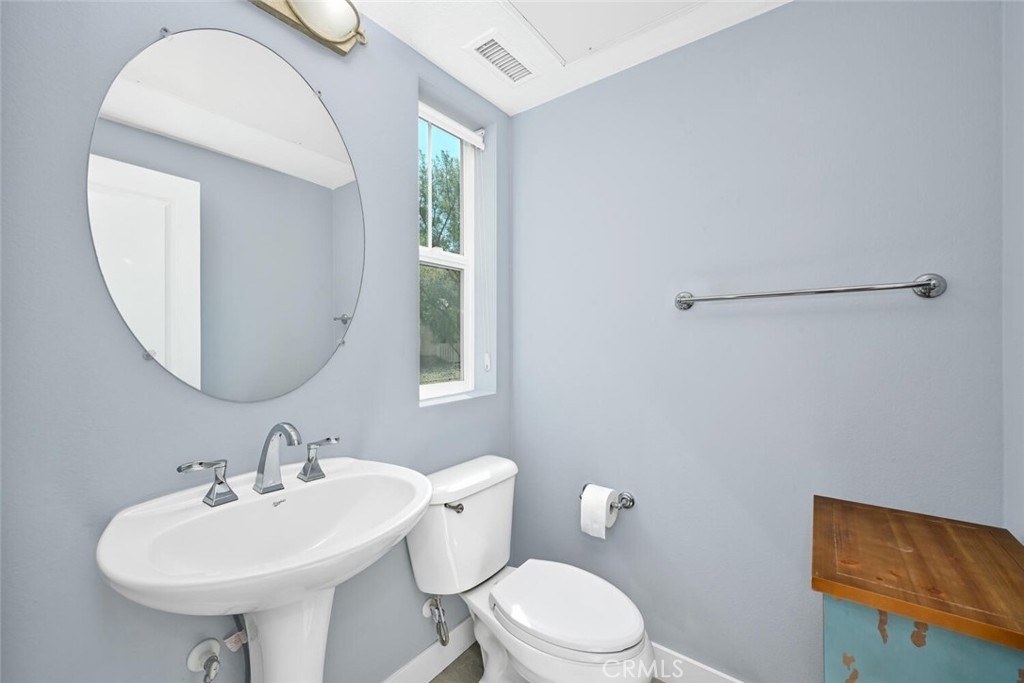22 Valmont Way Ladera Ranch, CA 92694 - Photo 25 of 47 a bathroom with a sink a mirror and a toilet