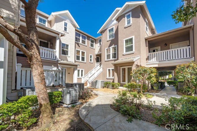 22 Valmont Way Ladera Ranch, CA 92694 - Photo 33 of 47 a view of a brick building next to a yard