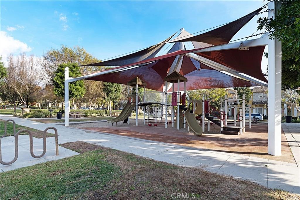 22 Valmont Way Ladera Ranch, CA 92694 - Photo 41 of 47 a view of a chairs and table in backyard of a house