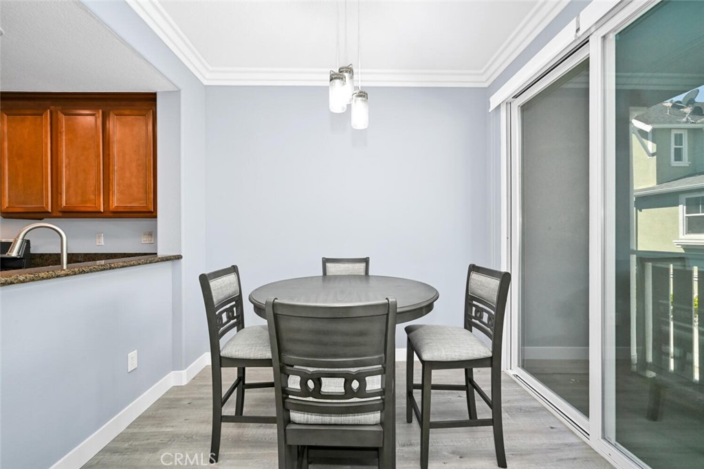22 Valmont Way Ladera Ranch, CA 92694 - Photo 7 of 47 a view of a dining room with furniture and wooden floor