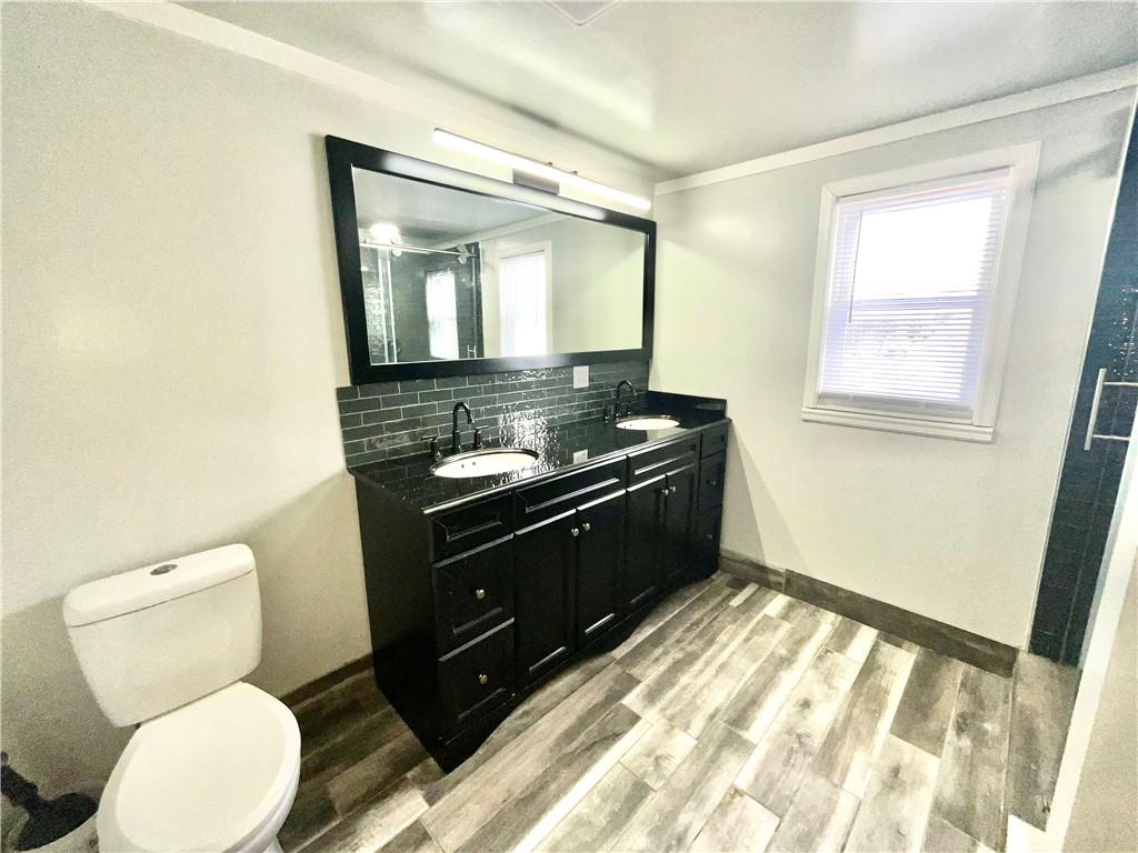 119 High Street Rices Landing, PA 15357 - Photo 17 of 46 a bathroom with a granite countertop toilet sink and mirror
