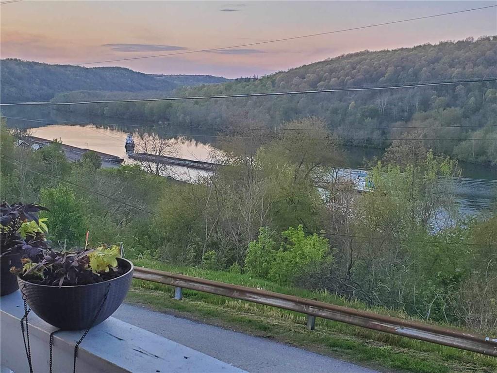 119 High Street Rices Landing, PA 15357 - Photo 23 of 46 a view of a lake with a mountain in the background