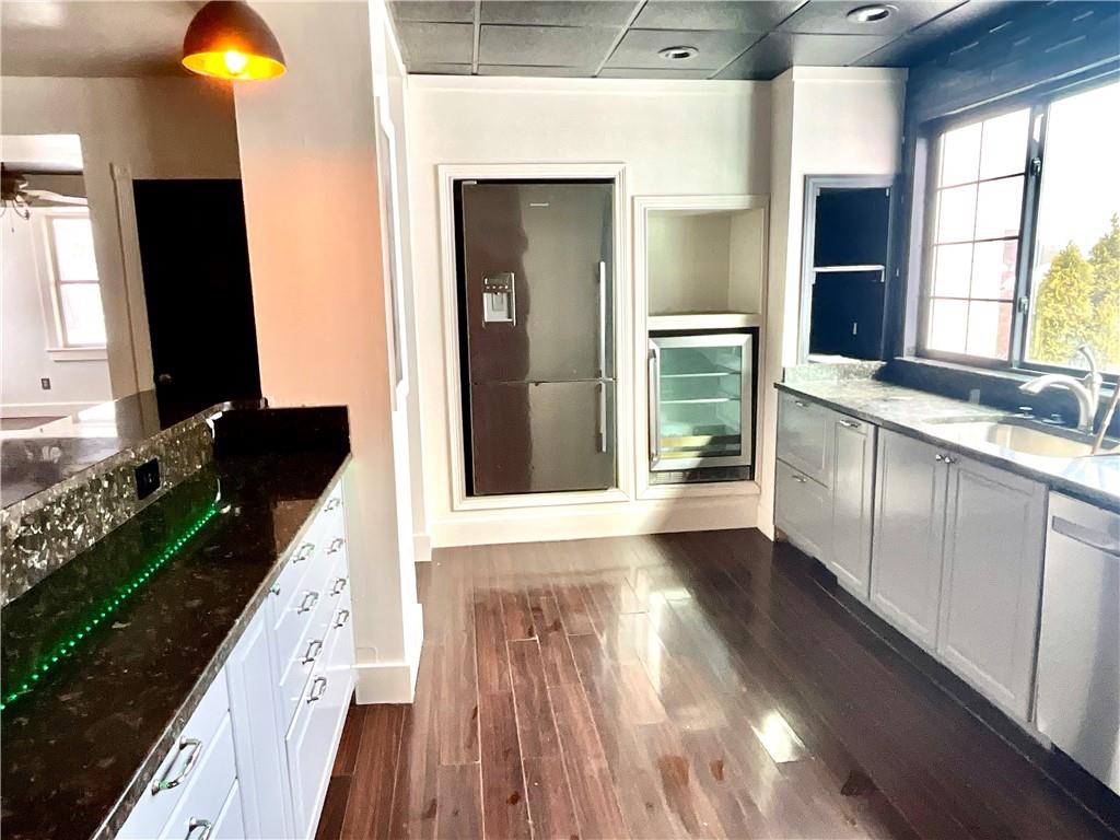 119 High Street Rices Landing, PA 15357 - Photo 6 of 46 a kitchen with granite countertop a stove and a wooden floor