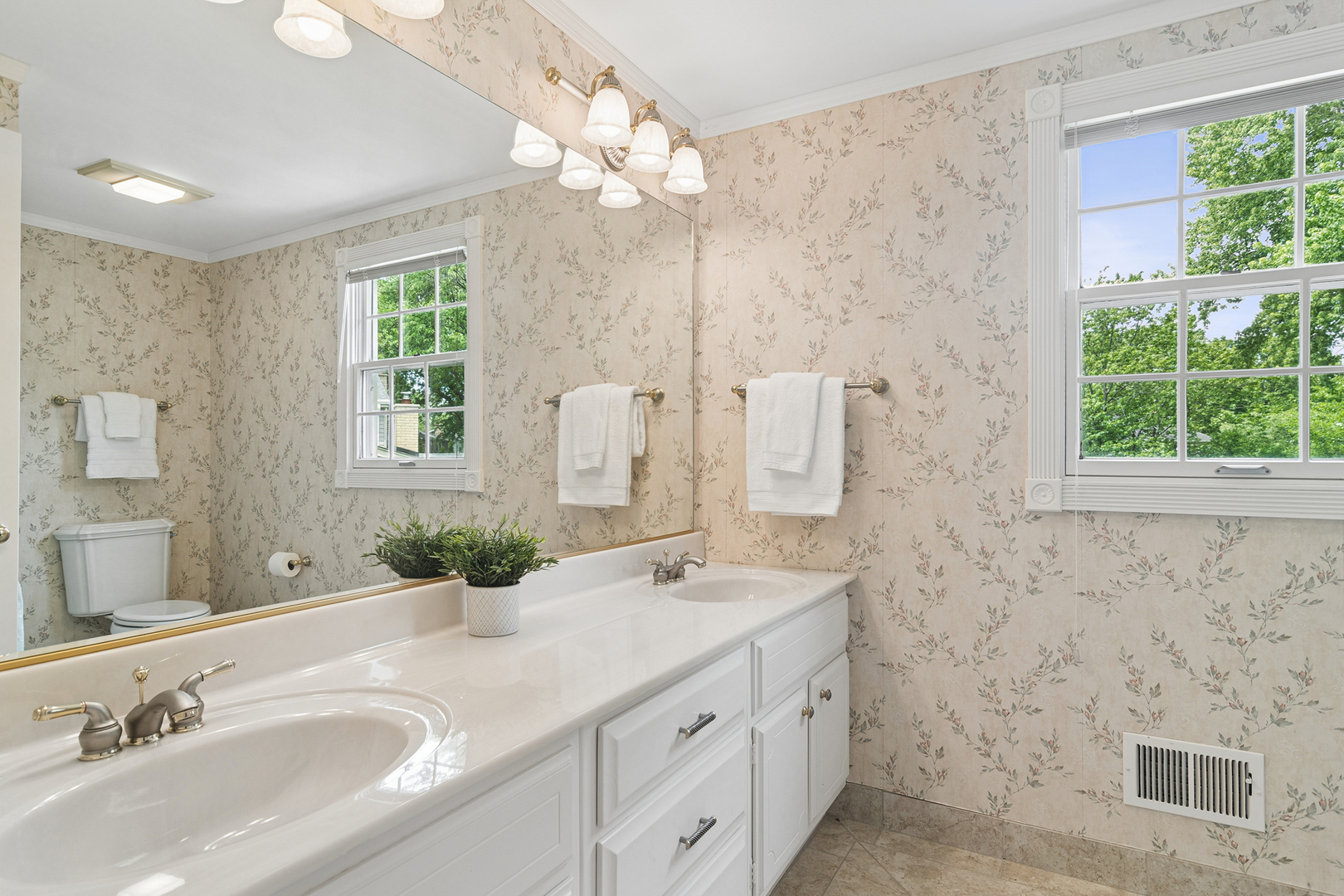 572 East Monterey Road Palatine, IL 60074 - Photo 19 of 27 a bathroom with a double vanity sink a mirror and a shower
