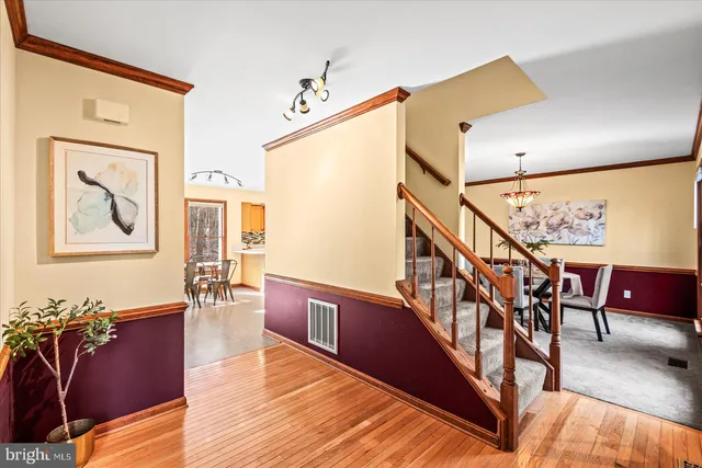 a livingroom with furniture wooden floor and windows