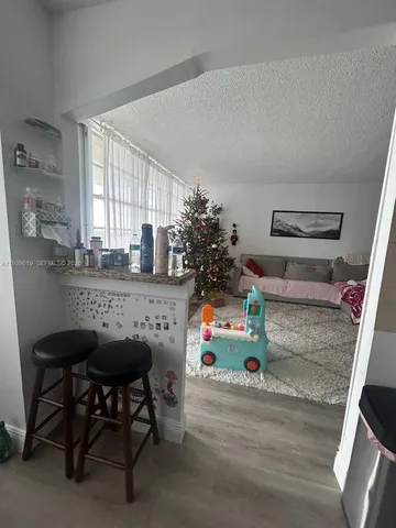 a children room with furniture and window