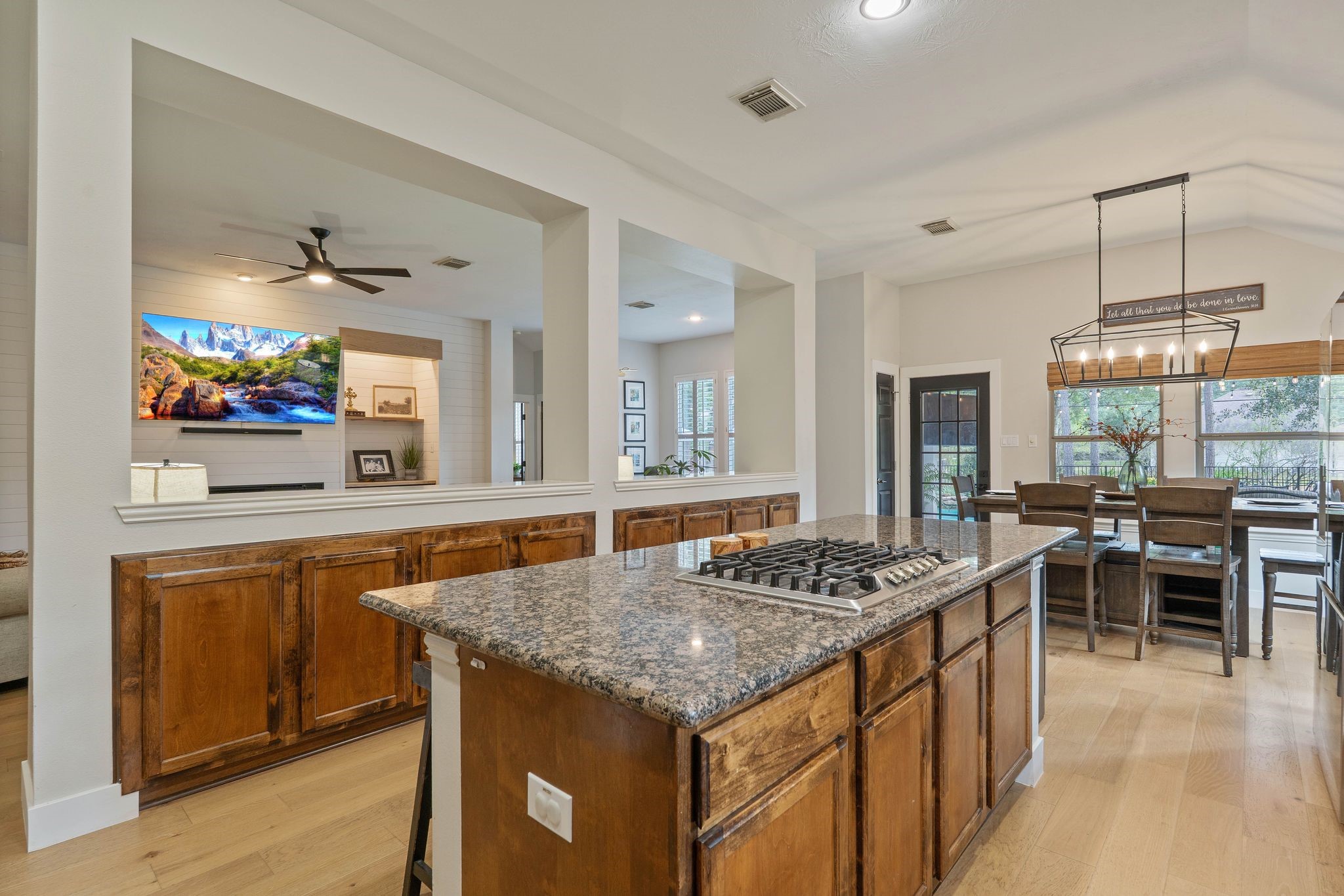 2408 Hollowbrook Lane Conroe, TX 77384 - Photo 16 of 49 Notice the built-in buffet separating the kitchen and family room.