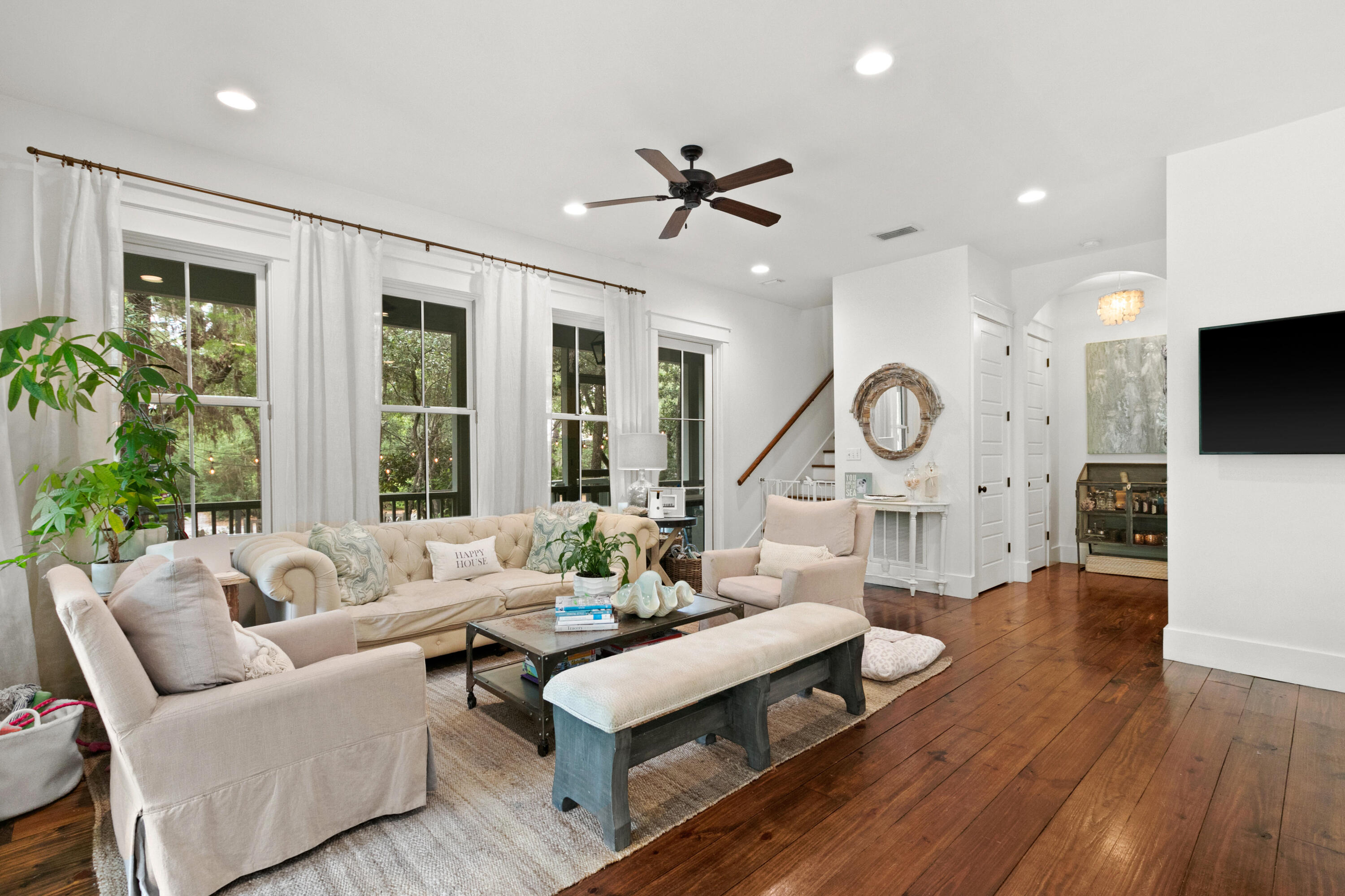 120 Hammock Lane Santa Rosa Beach, FL 32459 - Photo 12 of 57 a living room with furniture a fireplace and a large window