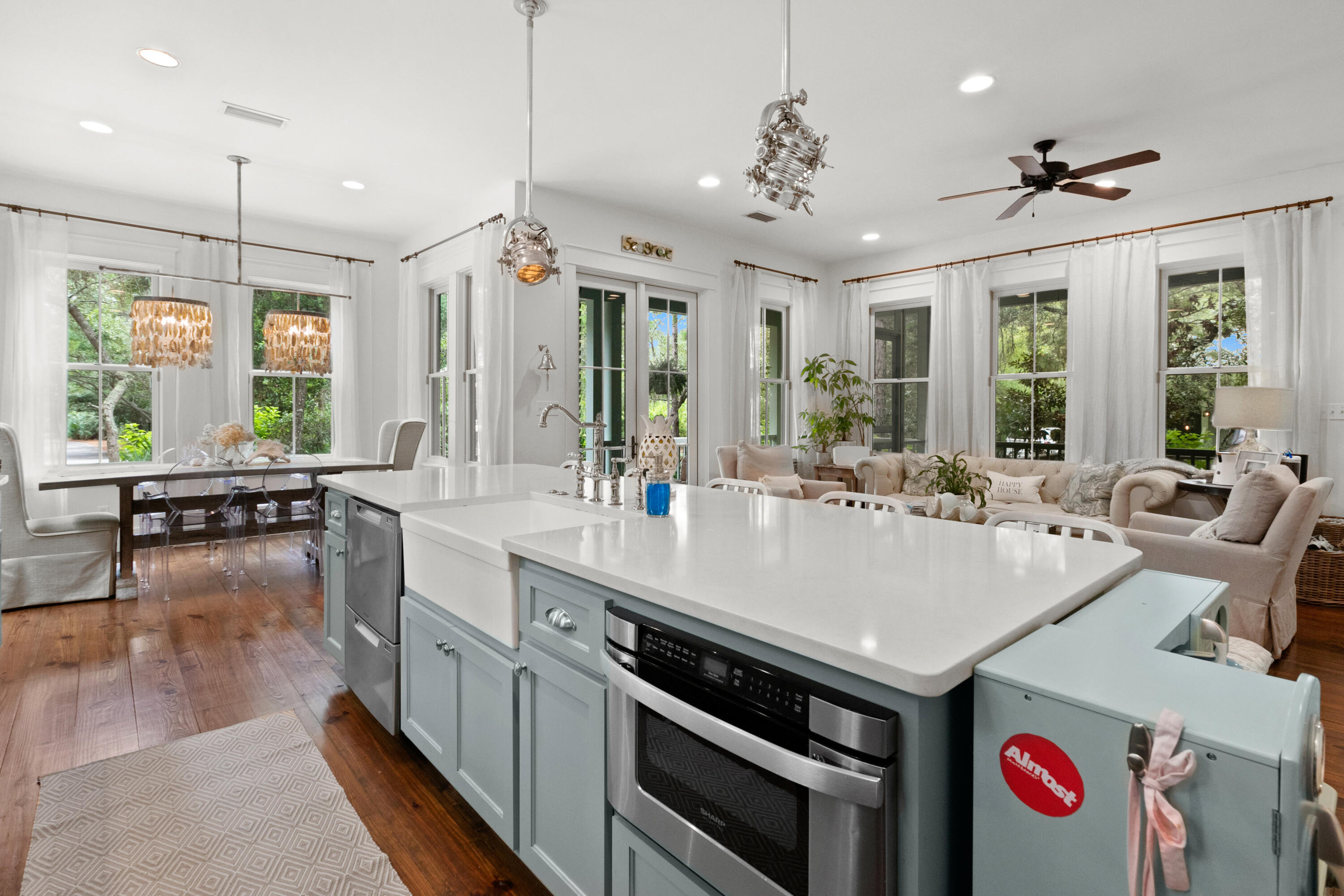 120 Hammock Lane Santa Rosa Beach, FL 32459 - Photo 23 of 57 a large kitchen with kitchen island a stove a sink a dining table and chairs