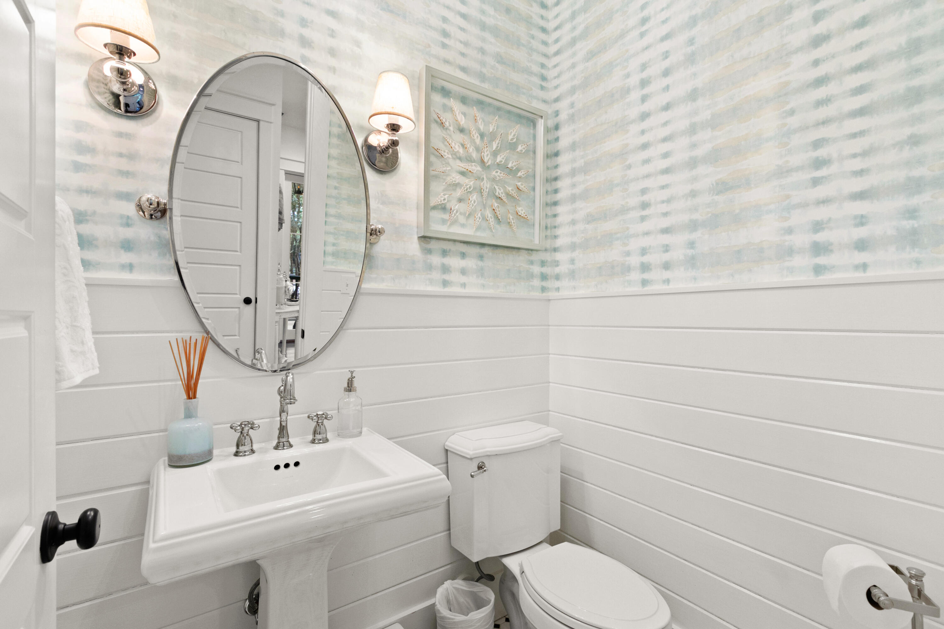 120 Hammock Lane Santa Rosa Beach, FL 32459 - Photo 25 of 57 a bathroom with a toilet sink and mirror