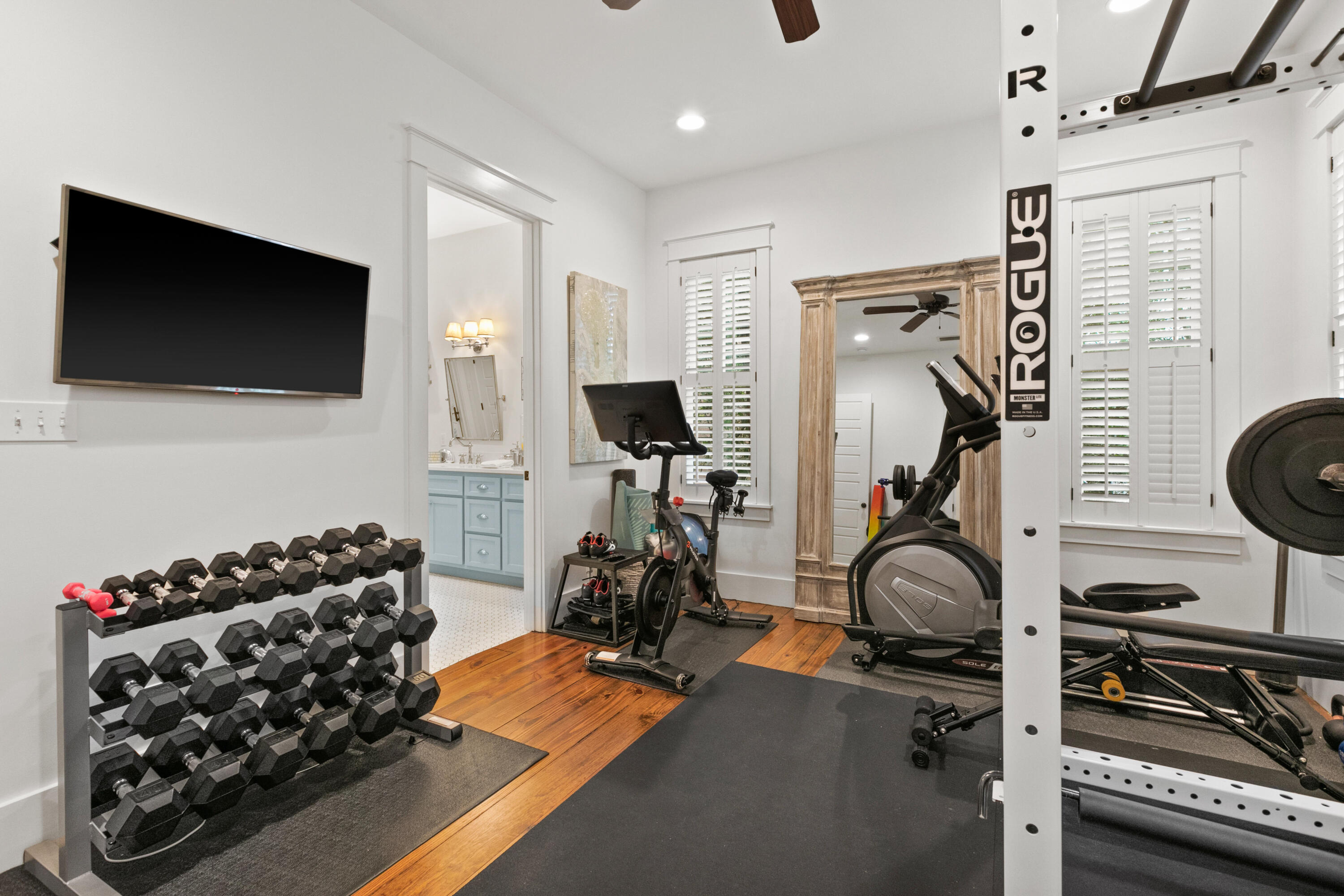 120 Hammock Lane Santa Rosa Beach, FL 32459 - Photo 27 of 57 a room with gym equipment and a flat screen tv