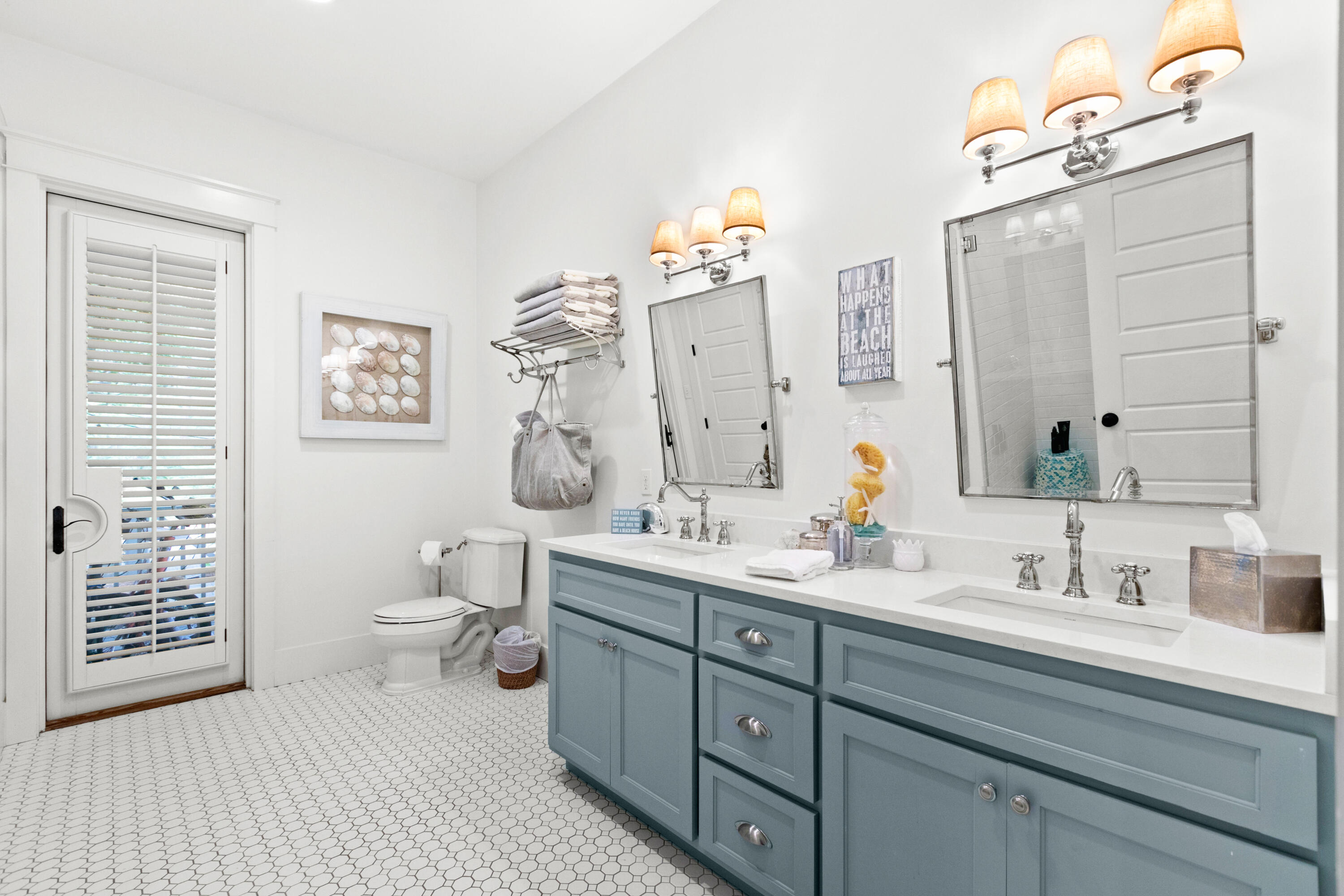 120 Hammock Lane Santa Rosa Beach, FL 32459 - Photo 28 of 57 a bathroom with double sink a toilet a shower and a mirror