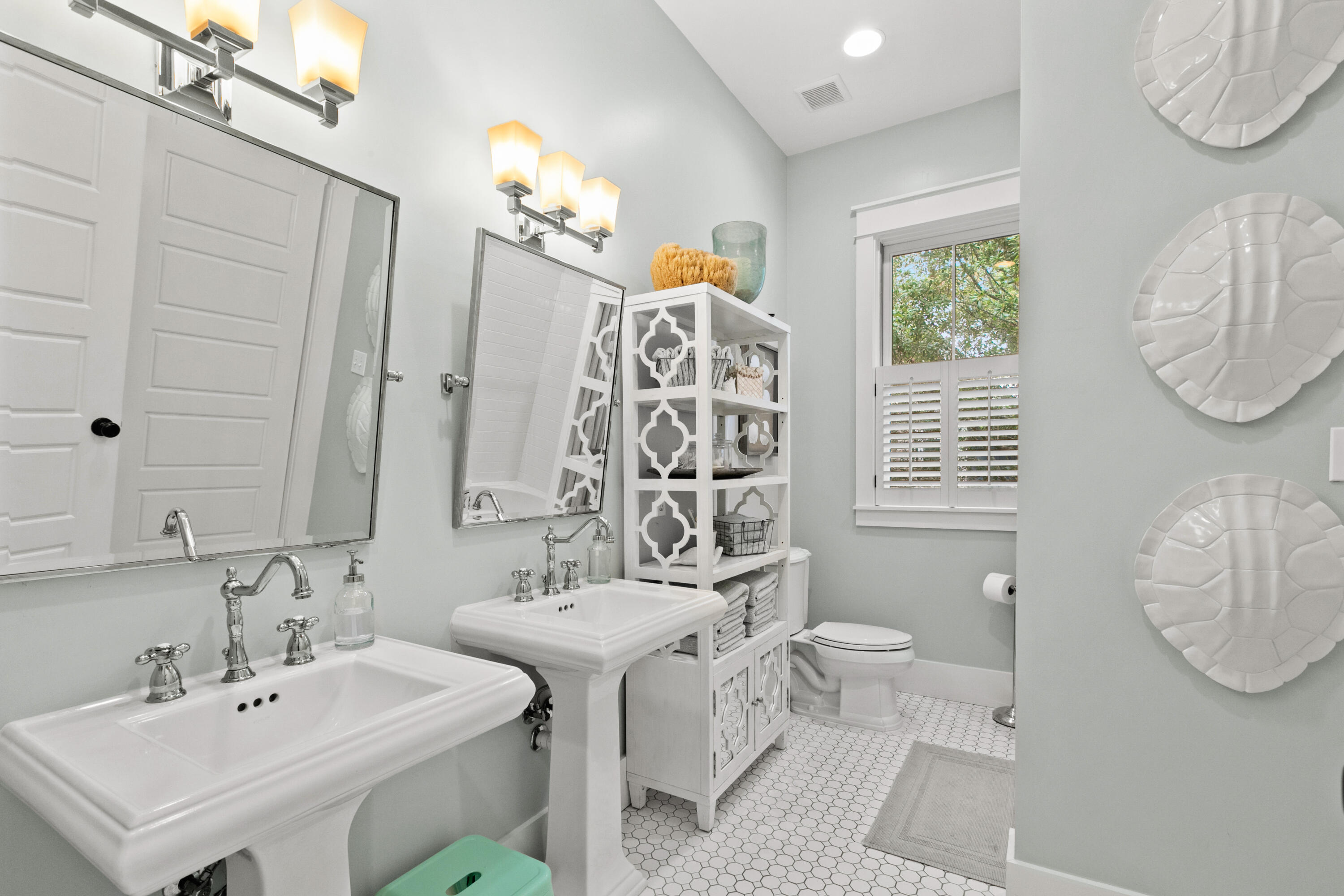 120 Hammock Lane Santa Rosa Beach, FL 32459 - Photo 41 of 57 a bathroom with a sink a toilet and a mirror