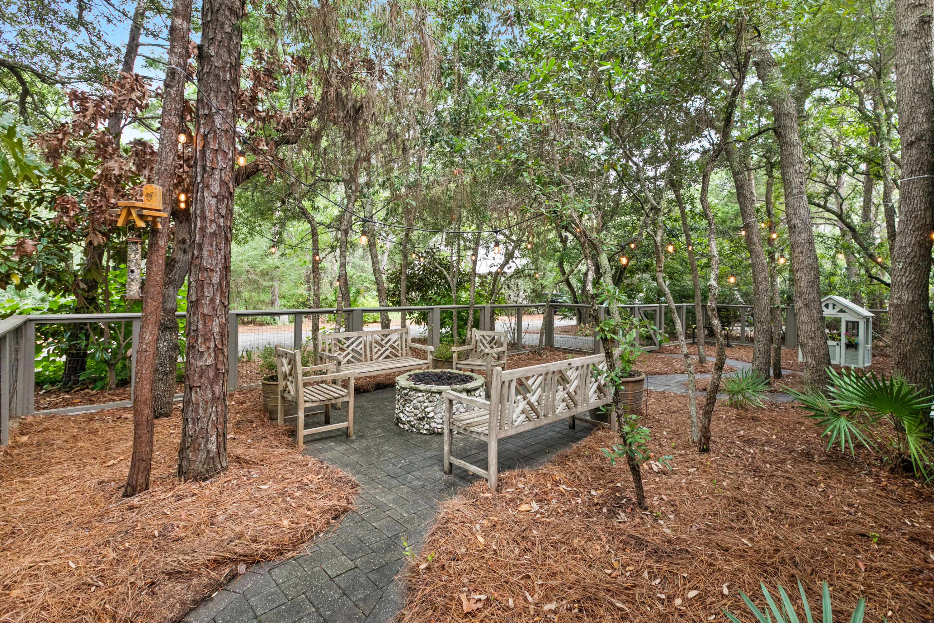 120 Hammock Lane Santa Rosa Beach, FL 32459 - Photo 57 of 57 a view of a wooden bench sitting in the backyard