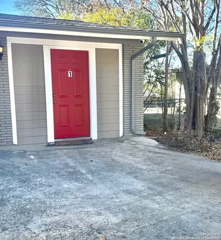 a view of a livingroom with wooden floor and a ceiling fan