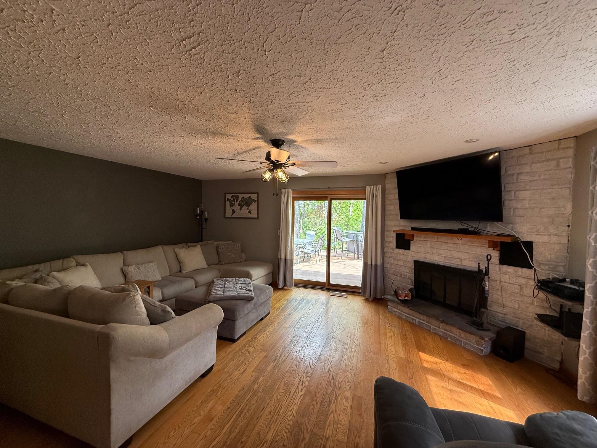 7758 Ray Court Roscoe, IL 61073 - Photo 15 of 37 a living room with furniture and a flat screen tv